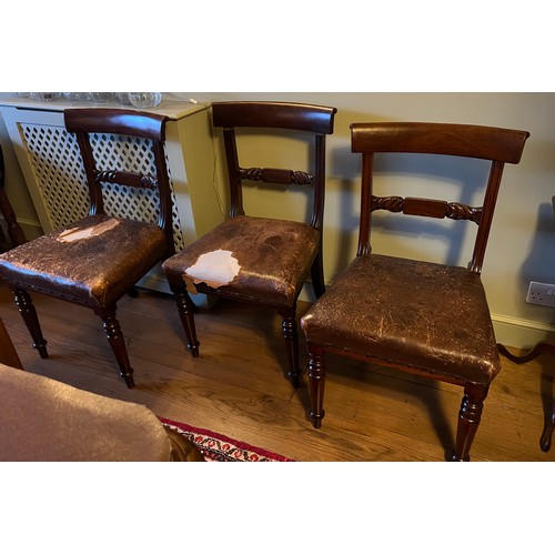 20 - Three 19thC bar backed mahogany dining chairs with leather seats.