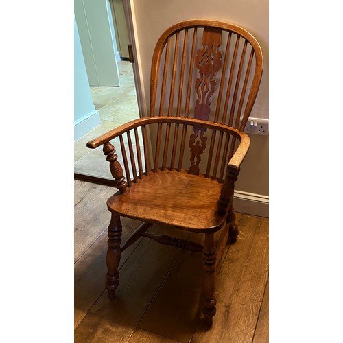 21 - A 19thC high backed ash and elm Windsor armchair. 105cm h to back.