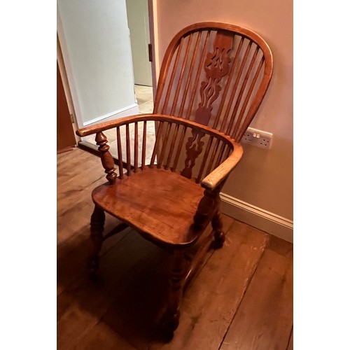 21 - A 19thC high backed ash and elm Windsor armchair. 105cm h to back.