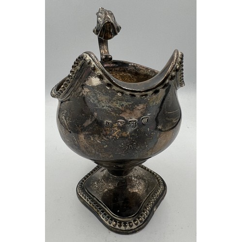 665 - A hallmarked silver jug London 1774, maker TE. 15cm h. Weight 409gm.