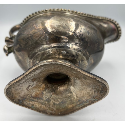 665 - A hallmarked silver jug London 1774, maker TE. 15cm h. Weight 409gm.