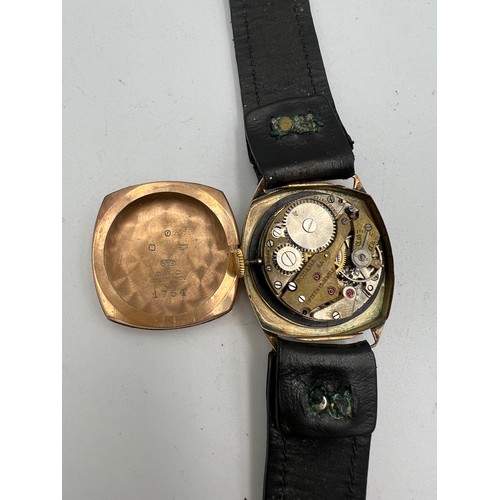 531 - A 9 carat gold gentleman’s wristwatch with subsidiary seconds hand and leather strap. Marked Rodana ... 