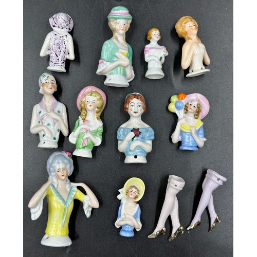 201 - A collection of 19th and early 20thC porcelain half dolls, tallest 12cm, smallest 5cm, some marked w... 