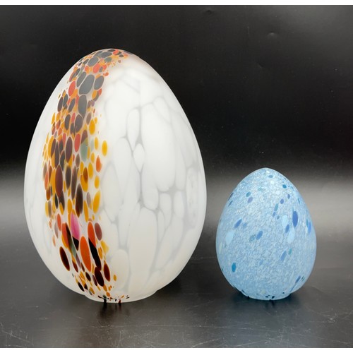 319 - Nine Kosta Boda glass eggs, two by Monica Backstrom with engraved signature to the base, approx. 24c... 