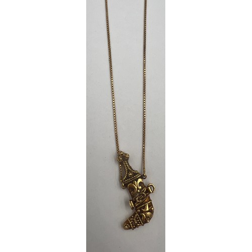 359 - An 18 carat yellow gold knife pendant on a fine 18 carat gold chain. Total weight 9.1gm.