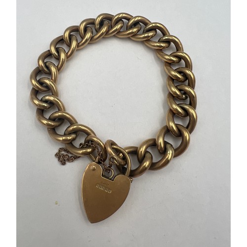 363 - A 9 carat gold chain link bracelet with heart shaped padlock fastening and safety chain. Weight 22.9... 