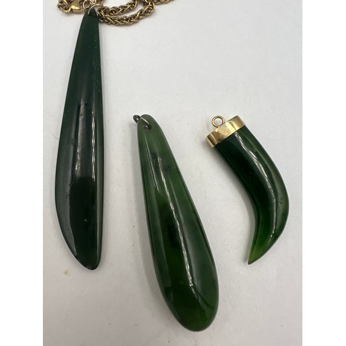 364 - Three jade pendants, one with a 9 carat gold chain, length 60cm, weight approximately 12gm, one with... 