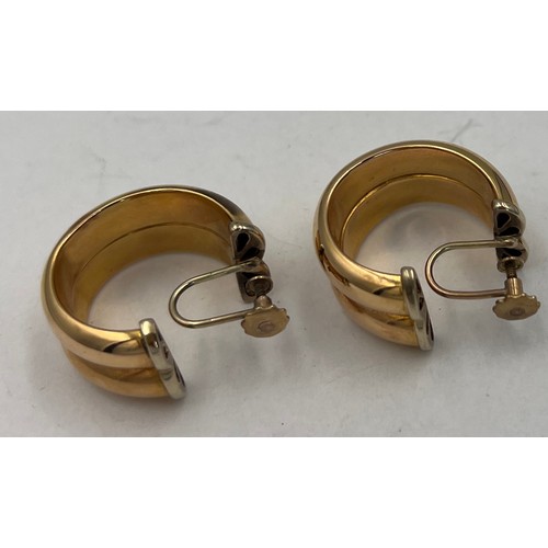 371 - A pair of half hoop screw on earrings, marked 9 carat to screw end. Hoop unmarked. Weight 9.5gm.