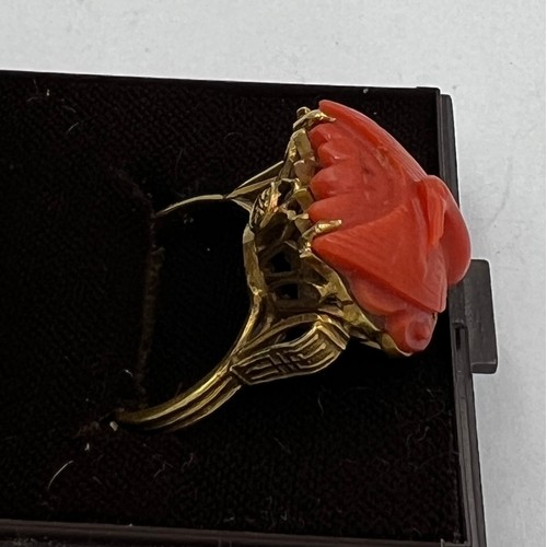 374 - A Chinese 14 carat yellow gold ring set with carved coral bird. Size M, weight 6.1gm.