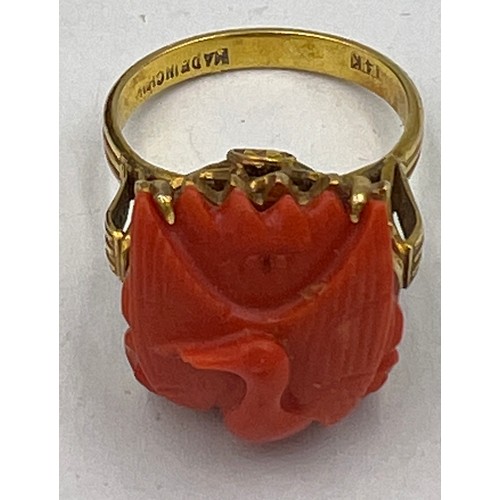 374 - A Chinese 14 carat yellow gold ring set with carved coral bird. Size M, weight 6.1gm.