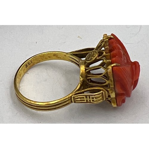 374 - A Chinese 14 carat yellow gold ring set with carved coral bird. Size M, weight 6.1gm.