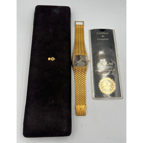 535 - An 18 carat gold Corum  bracelet watch with brown and cream feather dial, the winder set with a cabo... 