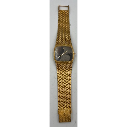 535 - An 18 carat gold Corum  bracelet watch with brown and cream feather dial, the winder set with a cabo... 