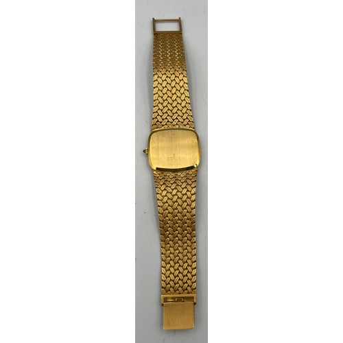 535 - An 18 carat gold Corum  bracelet watch with brown and cream feather dial, the winder set with a cabo... 