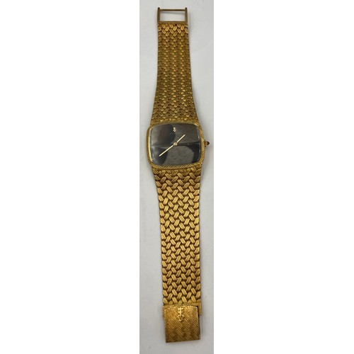 535 - An 18 carat gold Corum  bracelet watch with brown and cream feather dial, the winder set with a cabo... 