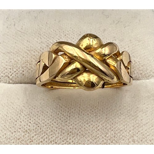 410 - A yellow metal ring, tests as 18 carat gold. Size O. Weight 5.5gm.