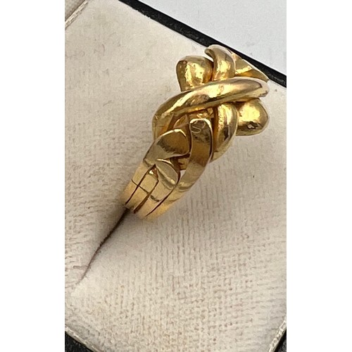 410 - A yellow metal ring, tests as 18 carat gold. Size O. Weight 5.5gm.