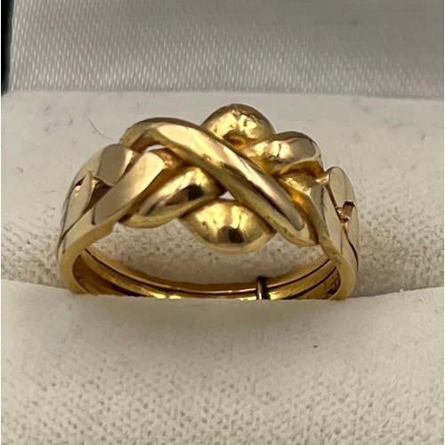 410 - A yellow metal ring, tests as 18 carat gold. Size O. Weight 5.5gm.