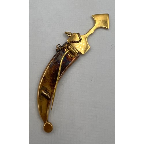 411 - A yellow metal dagger brooch, tests as approximately 14 carat gold. Lenght 6cm l. Weight 6gm.