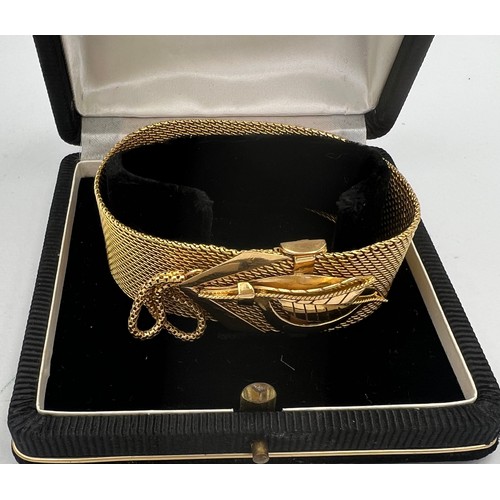 413 - A yellow metal bracelet in original presentation box. Length 22.5cm. Weight 69.3gm. Tests as approxi... 