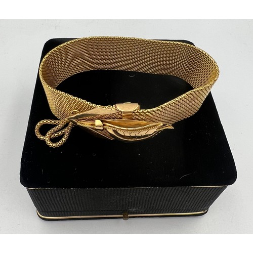 413 - A yellow metal bracelet in original presentation box. Length 22.5cm. Weight 69.3gm. Tests as approxi... 