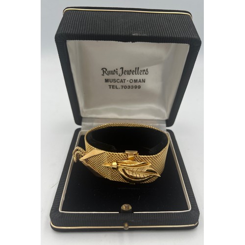 413 - A yellow metal bracelet in original presentation box. Length 22.5cm. Weight 69.3gm. Tests as approxi... 