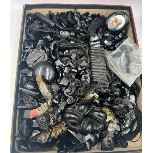 389 - A box full of Victorian jet pieces to include chain, bracelets, brooches, buttons etc. Plus the odd ... 