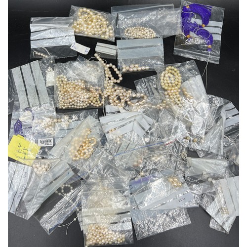 397 - A box of various cultured pearl necklaces and loose beads, most in need of re threading.