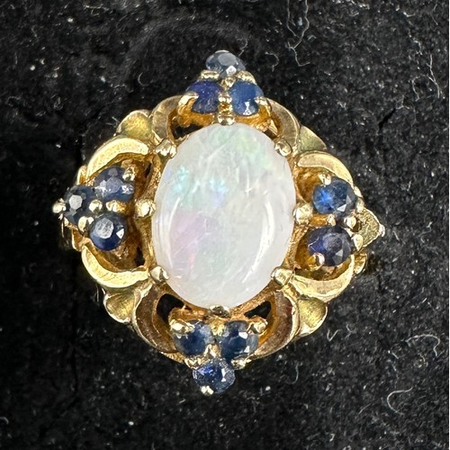 409 - A 9ct gold cluster ring set with central opal and sapphires 535gms, size P/Q.