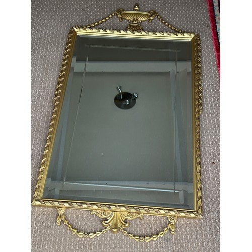 1012 - A Reflectwell heavy gilt effect period style mirror. 107 h x 57cm w.