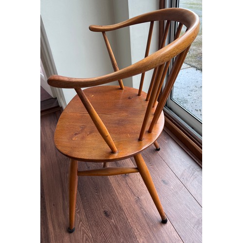 1 - An Ercol blonde carver chair.