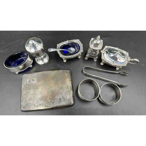 650 - Silver to include a cruet set , Birmingham JD & S 1967, silver cigarette case, sugar tongs, 2 x napk... 