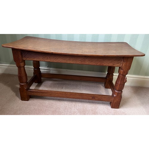 138 - A 1960's Robert Thompson Mouseman oak seat, curved rectangular top with adzed decoration, four carve... 