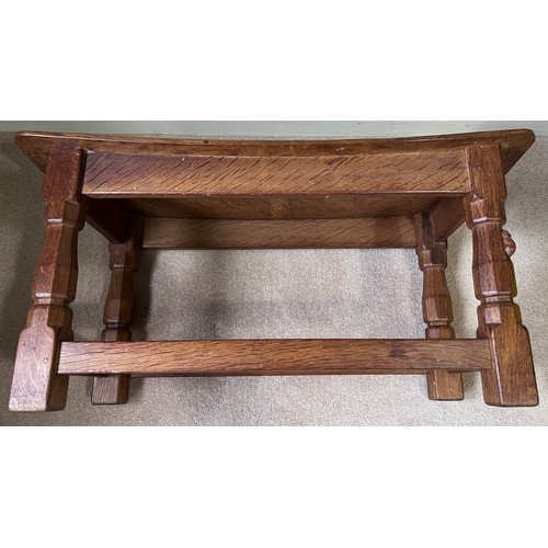 138 - A 1960's Robert Thompson Mouseman oak seat, curved rectangular top with adzed decoration, four carve... 