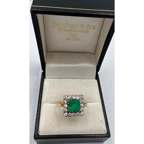 345 - A square cut emerald and diamond ring set in unmarked yellow and white metal. Head size approximatel... 