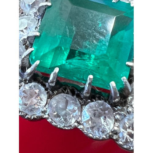 345 - A square cut emerald and diamond ring set in unmarked yellow and white metal. Head size approximatel... 