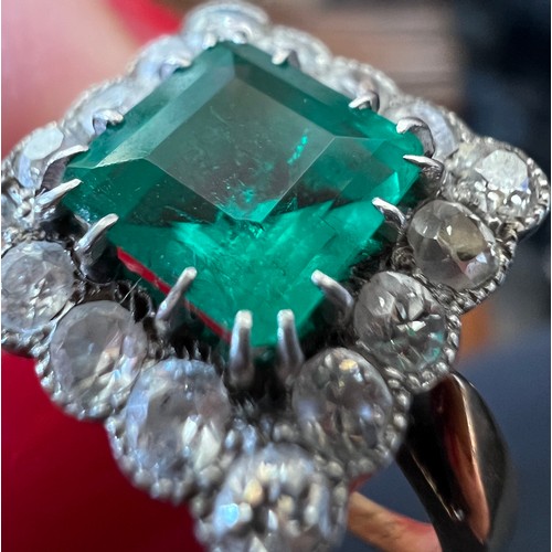 345 - A square cut emerald and diamond ring set in unmarked yellow and white metal. Head size approximatel... 