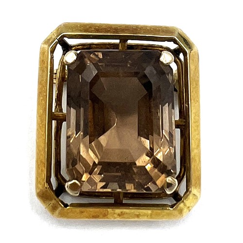 347 - A Smokey quartz brooch set in 14 carat gold. Size approximately 2cm x 2.2cm. Weight 8.3gm.