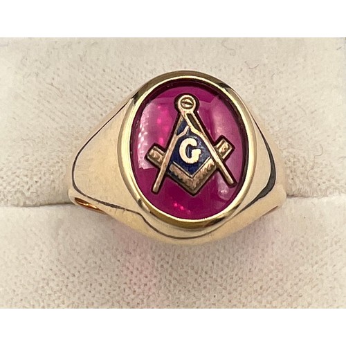 338 - A 14 carat gold Masonic ring with synthetic ruby and Masonic symbol. Size R/S. Weight 7.2gm.