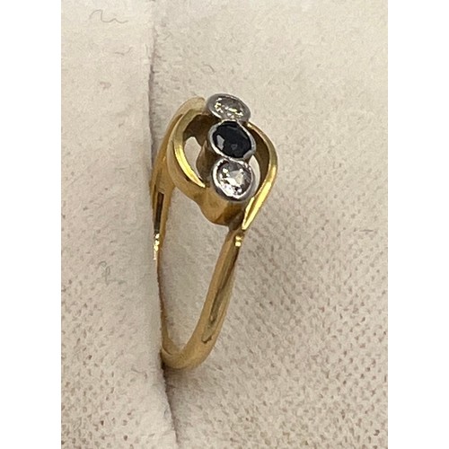 342 - An unmarked yellow metal ring set with sapphire and two diamonds. Size H/I, weight 1.6gm.