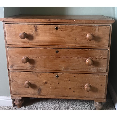 3 - A 19thC pine chest of three graduating drawers with wooden knobs. 91cm w x 46cm d x 88cm h.