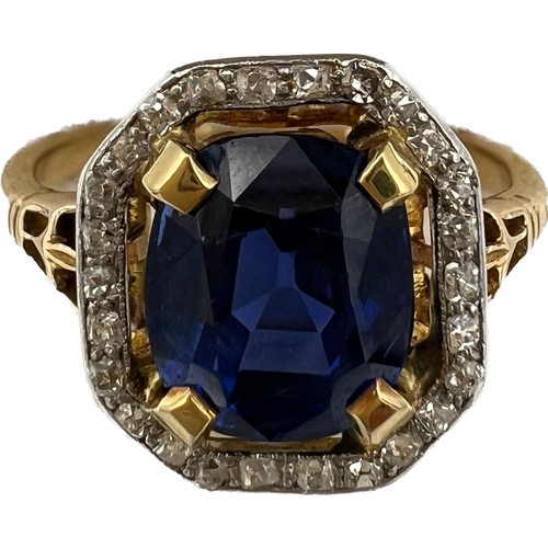 449 - A sapphire and diamond ring mounted in 18 carat gold and platinum. Size N/O. Weight 4.3gm. The cushi... 