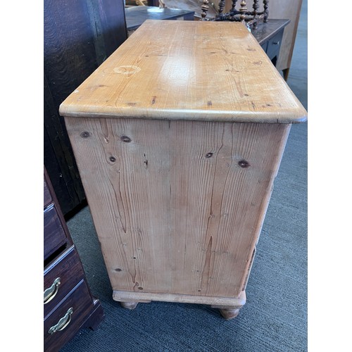 5A - A pine chest of 2 short over 2 long drawers with brass drop drop handles. 95 w x 44 d x 82cm h.