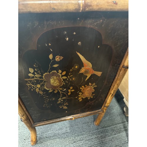 99 - A 19thC bamboo and lacquer kneehole desk with brass drop handles. 90cm w x 51cm d x 76cm h.