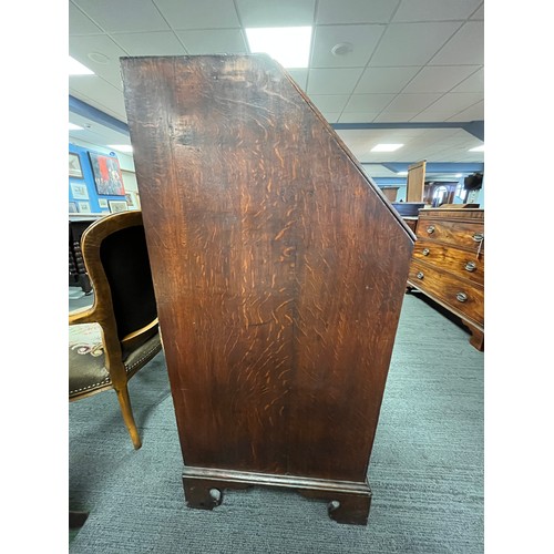 68 - An 18thC  oak bureau with four graduated drawers and bracket feet with fitted interior. 92cm x 108cm... 