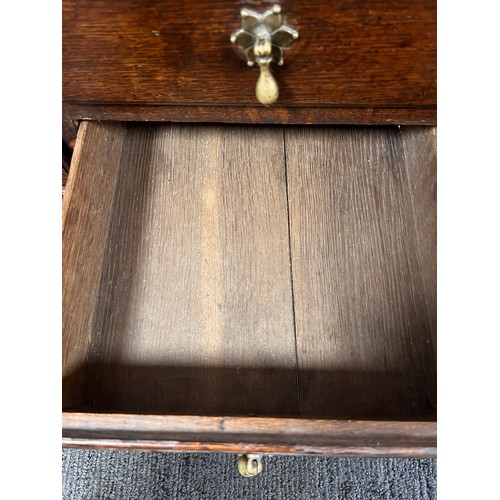 81 - Small oak chest with central door flanked by dummy drawers with others beneath. 63cm w x 44cm d x 64... 