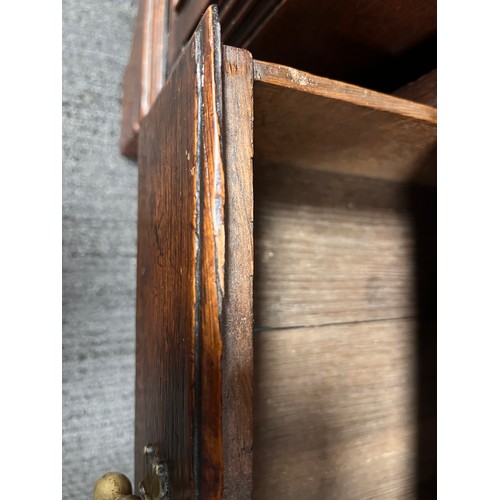 81 - Small oak chest with central door flanked by dummy drawers with others beneath. 63cm w x 44cm d x 64... 