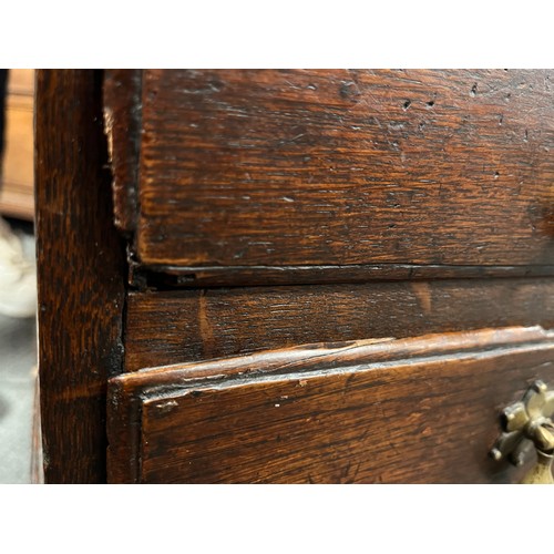 81 - Small oak chest with central door flanked by dummy drawers with others beneath. 63cm w x 44cm d x 64... 