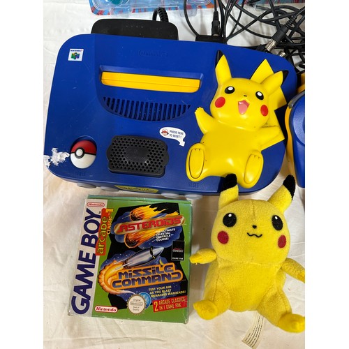 1142 - A Nintendo 64 Pikachu Pokémon games console with Pikachu controllers and 2 others, a Xena Warrior Pr... 