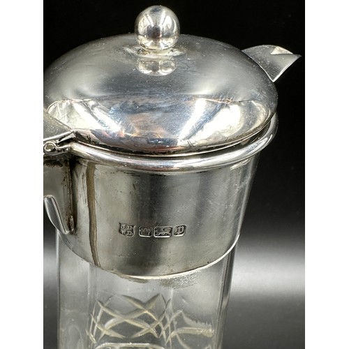 277 - An Edwardian silver mounted claret jug and cover, Sheffield 1907, by James Deakin & Sons (John & Wil... 